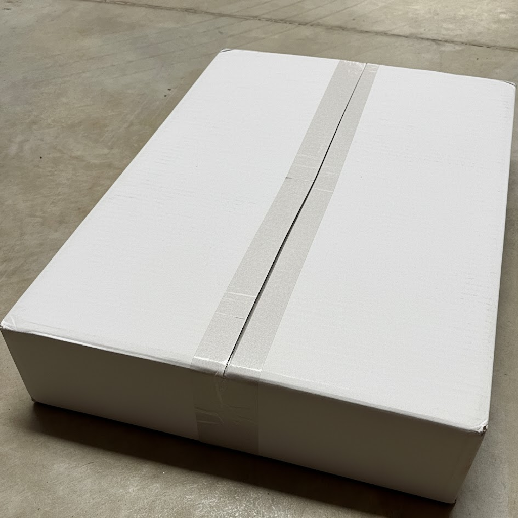 Présentation du colisage reçu pour le produit Papier Enduit PE 25x32 60g/m²